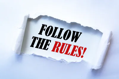 a ripped piece of paper with the words 'Follow the Rules' on it a ripped piece of paper with the words 'Follow the Rules' on it